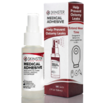 2 oz bottle of Skinister Medical medical adhesive spray next to the new packaging box with red accents, illustrating leak prevention and extended wear time for ostomy wafers and barriers.